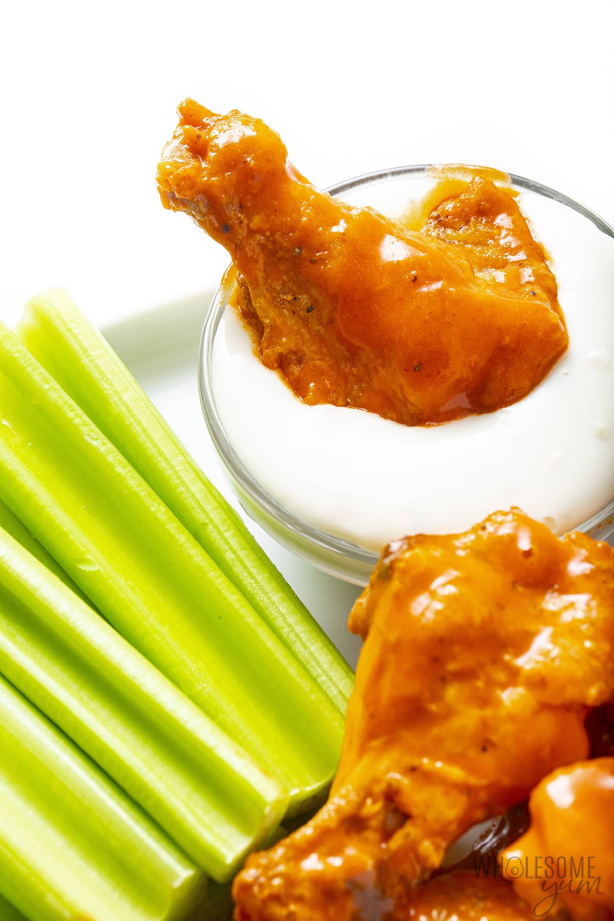 Buffalo wings dipped in blue cheese.