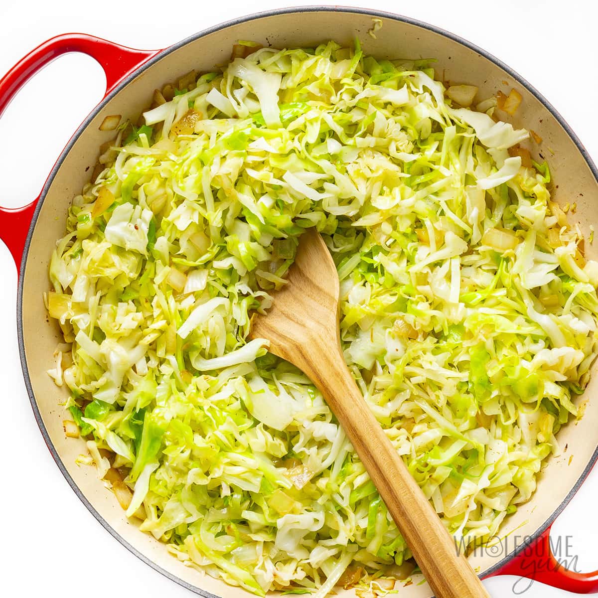 Cabbage added to the pan.