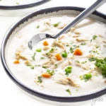 Slow cooker chicken pot pie soup in a bowl with a spoon