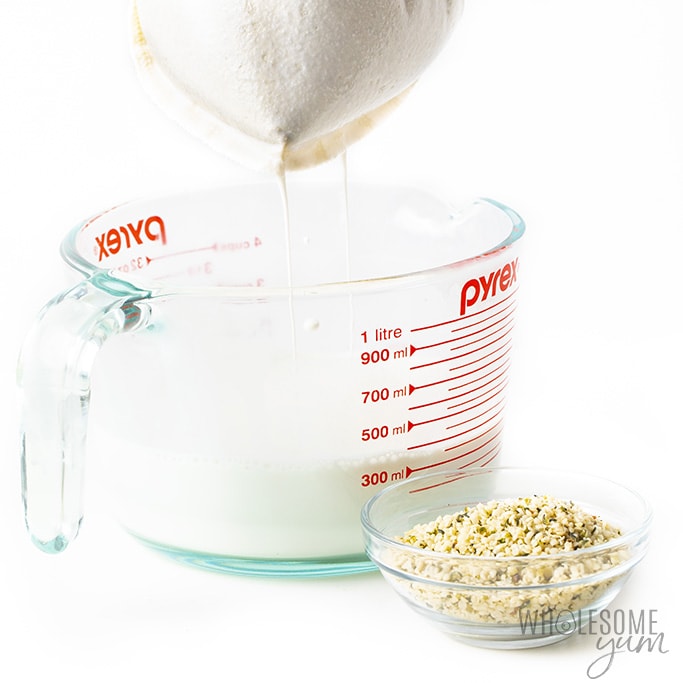 Organic hemp milk recipe straining over a glass container