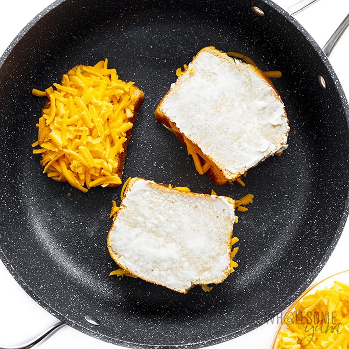 Keto friendly grilled cheese being cooked in a skillet.