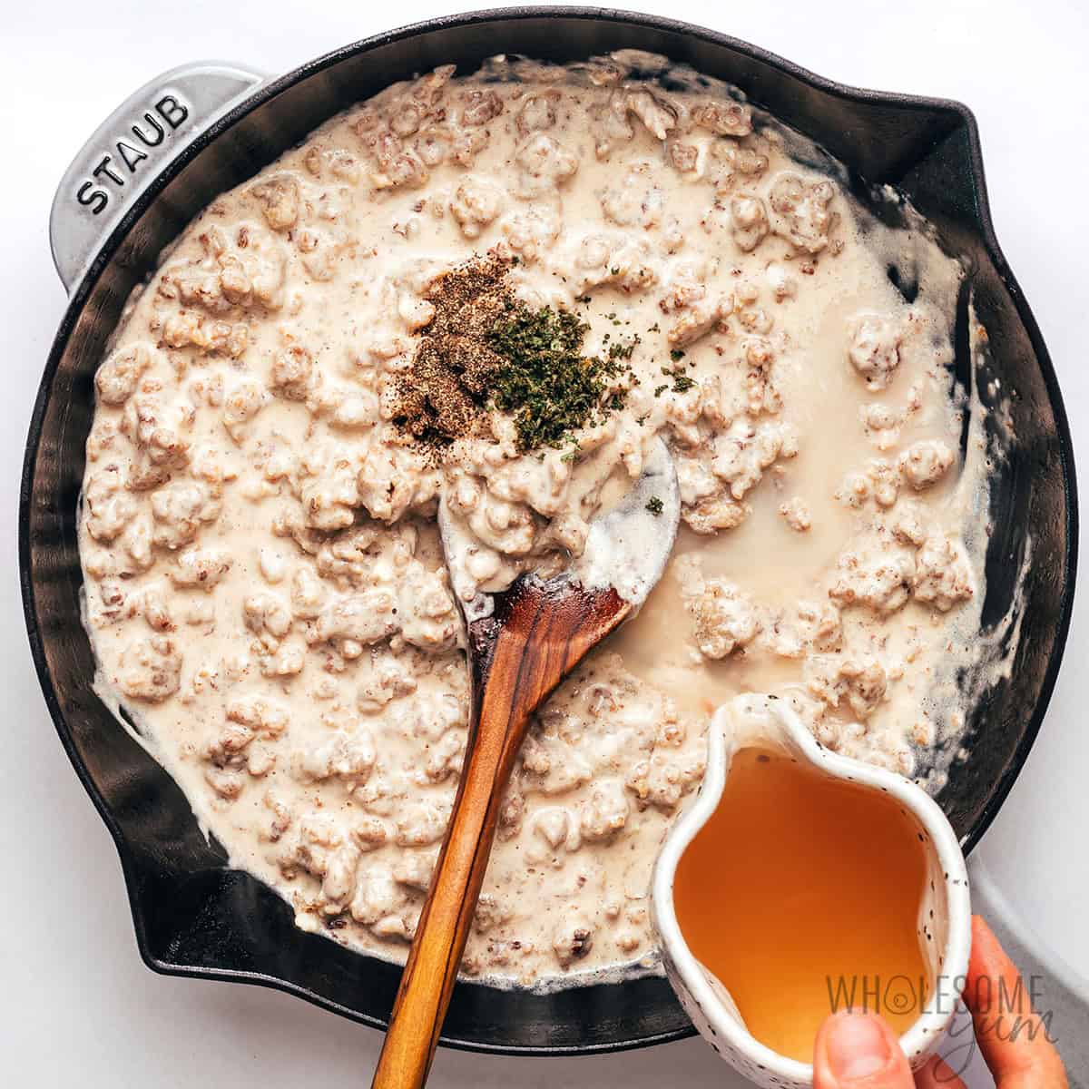 Chicken broth, ground sage, and black pepper stirred into sausage gravy.