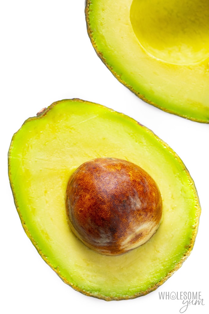 Avocado cut in half with pit