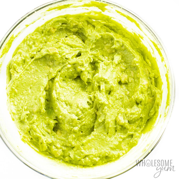 Mashed avocado in glass bowl