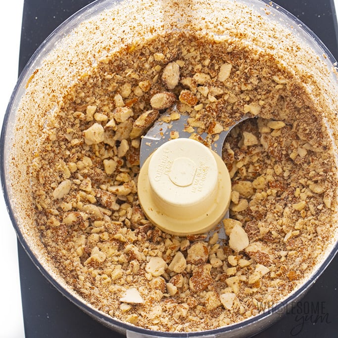 Food processor bowl with chopped almonds