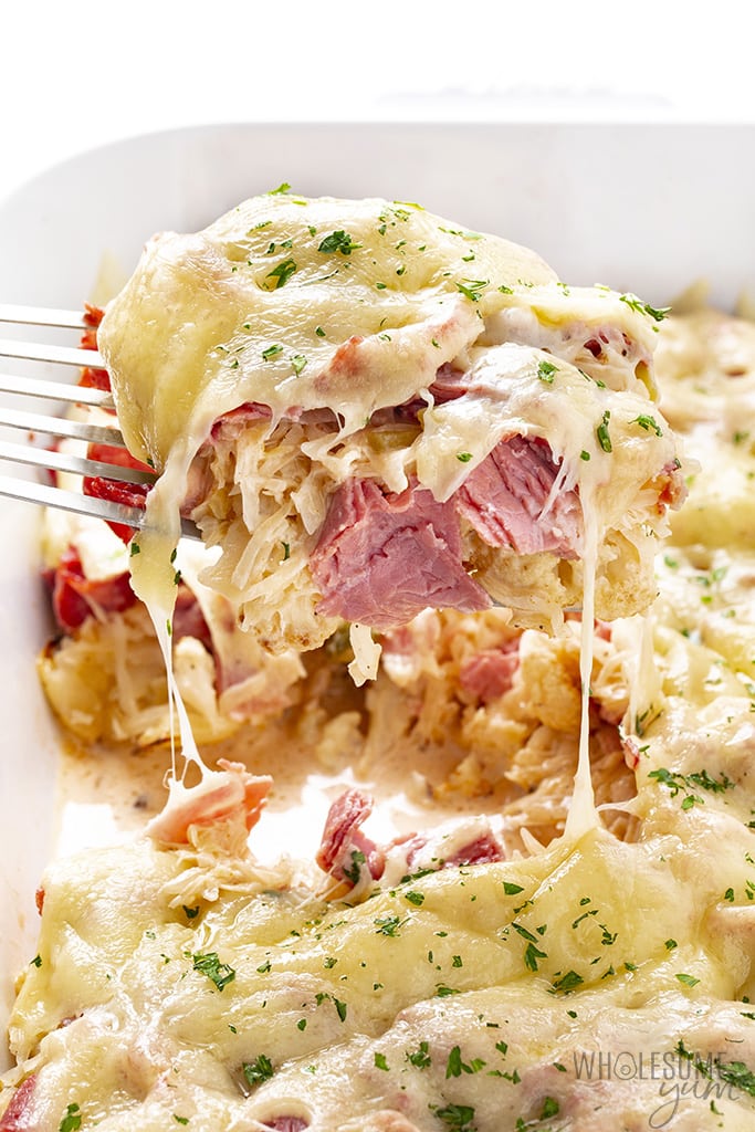 Slice of low carb reuben casserole lifting out of casserole dish