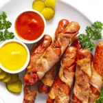 Bacon wrapped hot dogs recipe on a serving platter