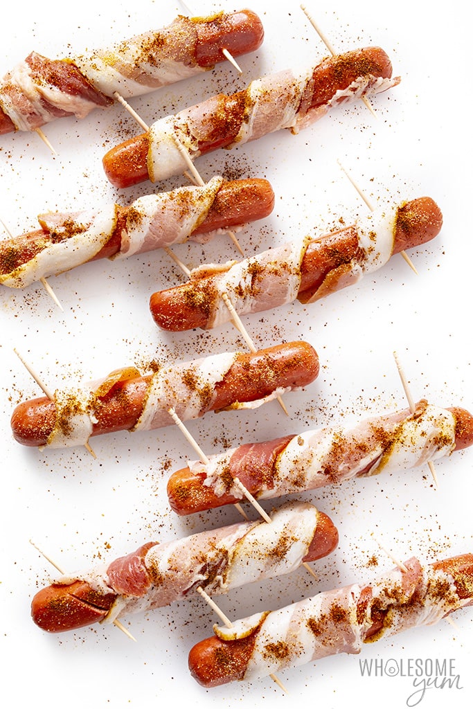 Bacon wrapped hot dogs sprinkled with spices
