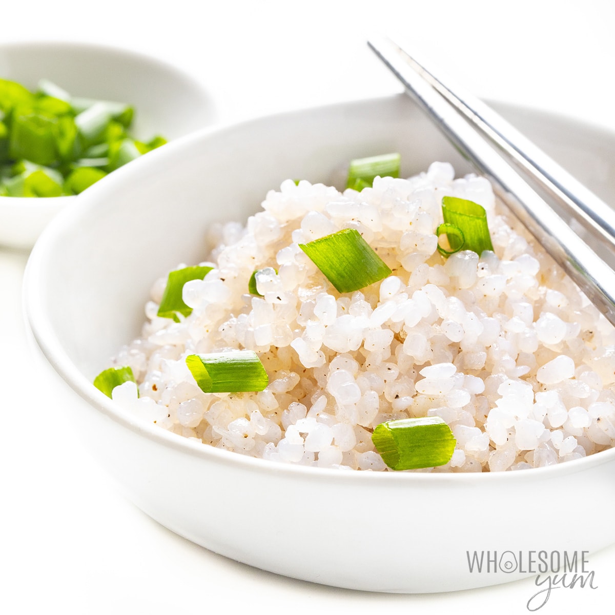 White bowl with shirataki rice and chopsticks