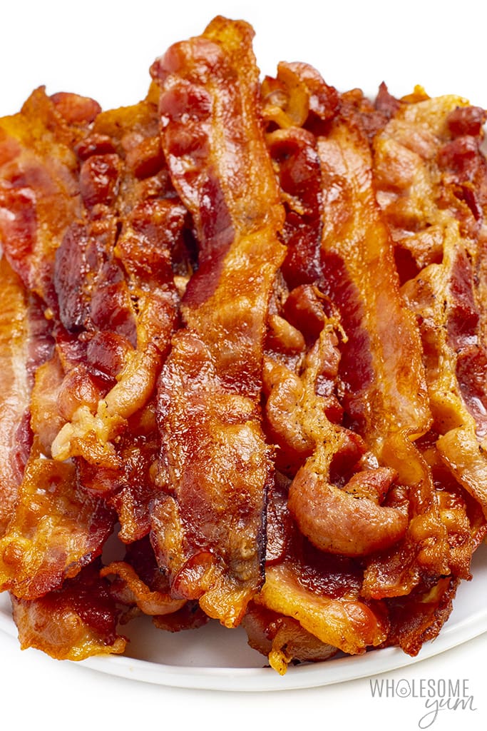 Is bacon keto? These cooked strips of bacon on a platter are keto friendly.