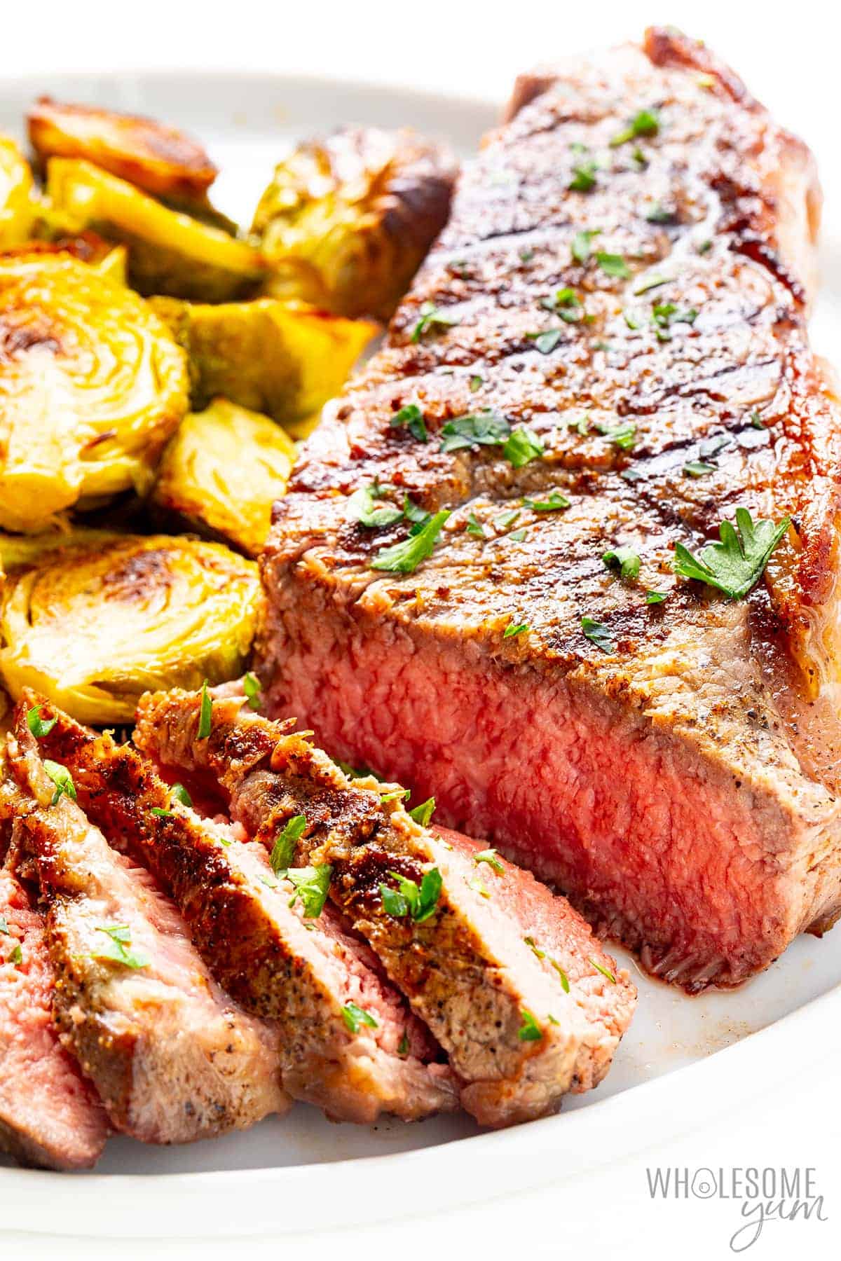 New York strip steak with roasted brussels sprouts.