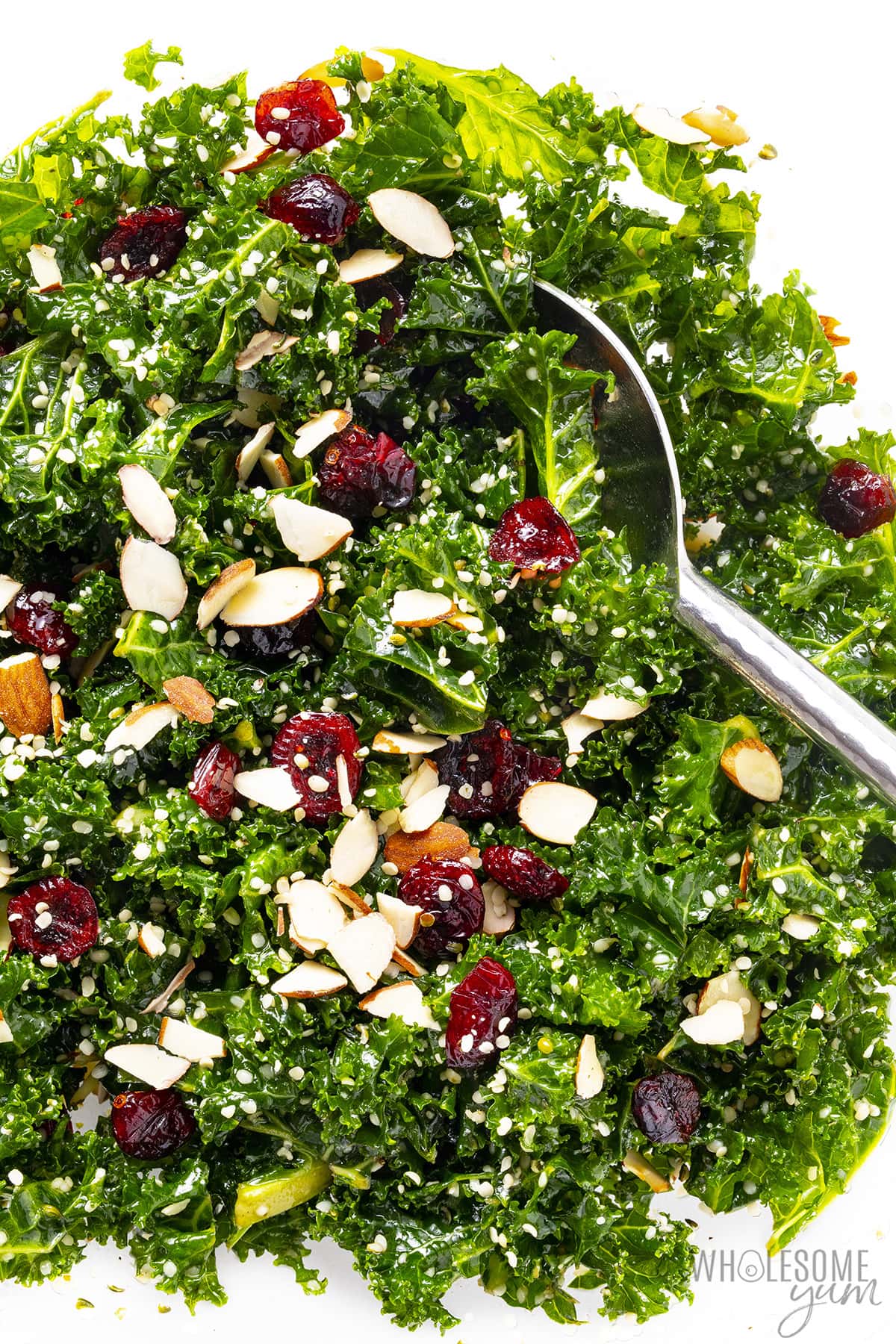Serve kale salad in a bowl with a spoon.