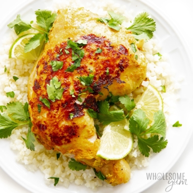 Tandoori chicken on plate with rice.