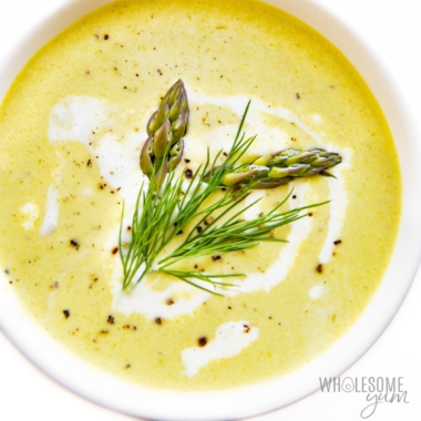 Bowl of cream of asparagus soup with dill and asparagus garnish