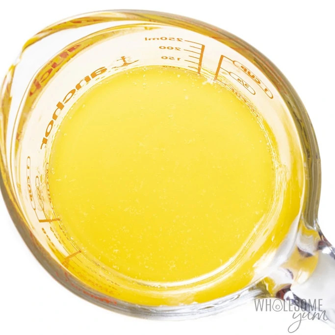 Melted butter in glass measuring cup