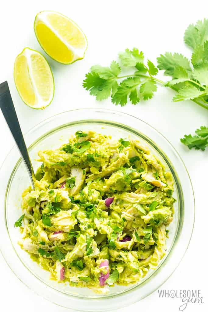 Avocado chicken salad ingredients mixed in a bowl