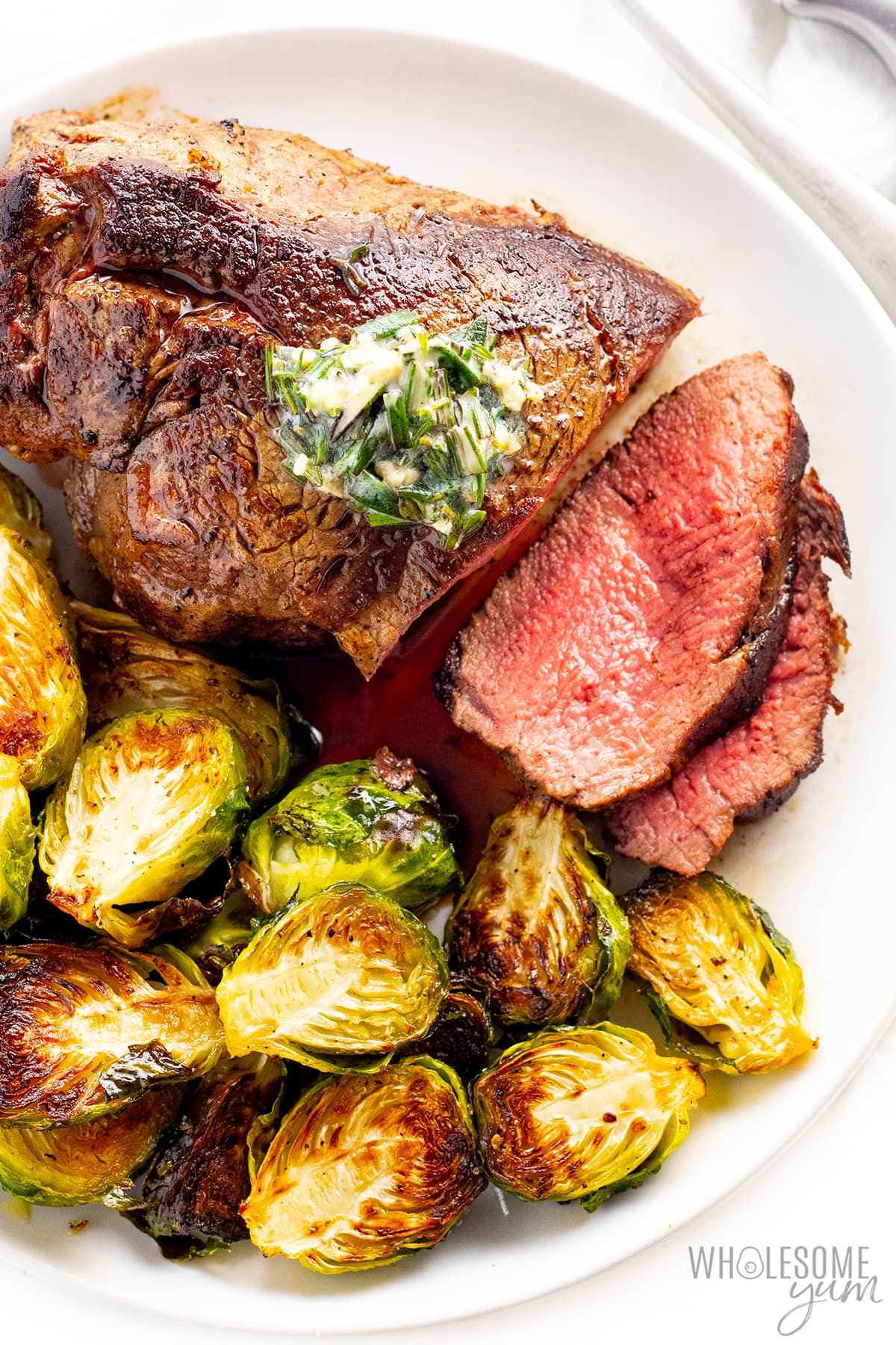 Learn the best way to cook filet mignon like this one shown with brussels sprouts.