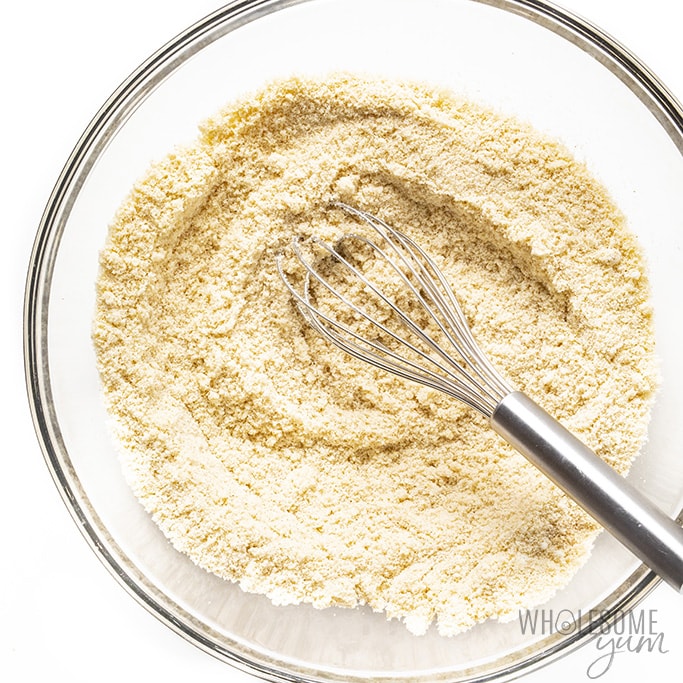 Dry ingredients for flatbread in a bowl with whisk