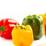 Several bell peppers on a white background.