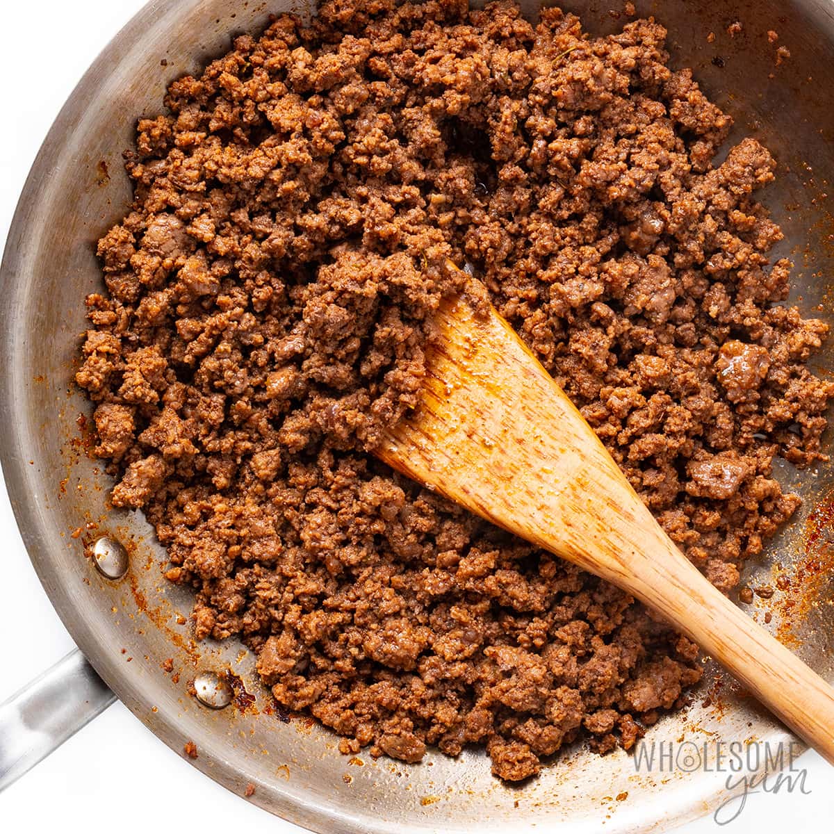 Ground beef with taco seasoning in a skillet.