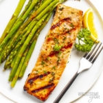 Grilled salmon on a plate with asparagus.