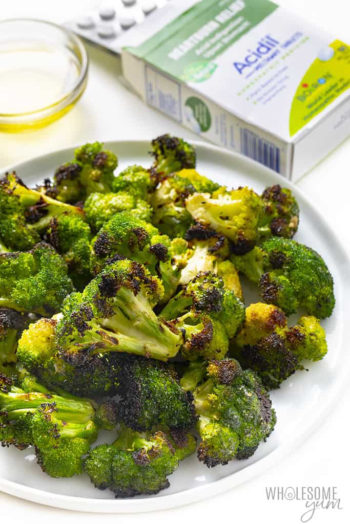 Complete roasted broccoli recipe on a plate with Acidil packaging