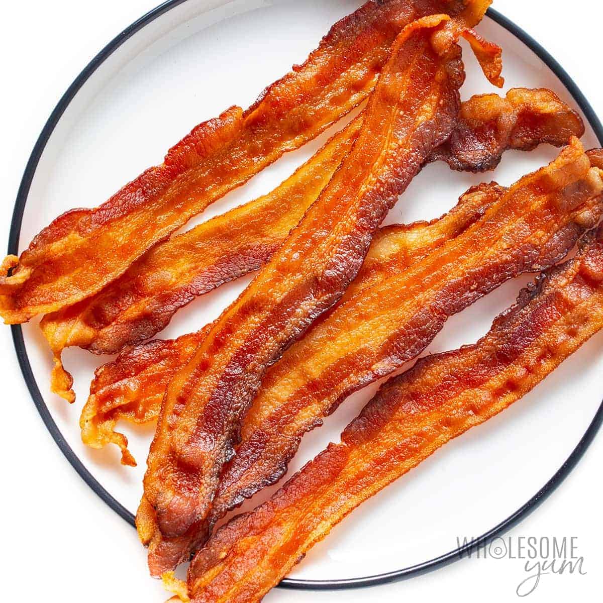 Crispy microwave bacon slices on a plate
