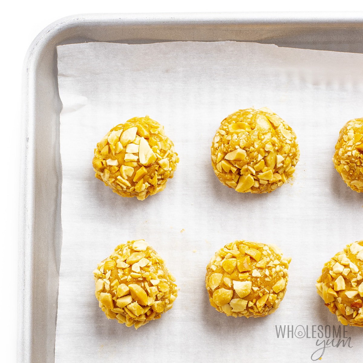 Finished no bake protein balls on a baking sheet.