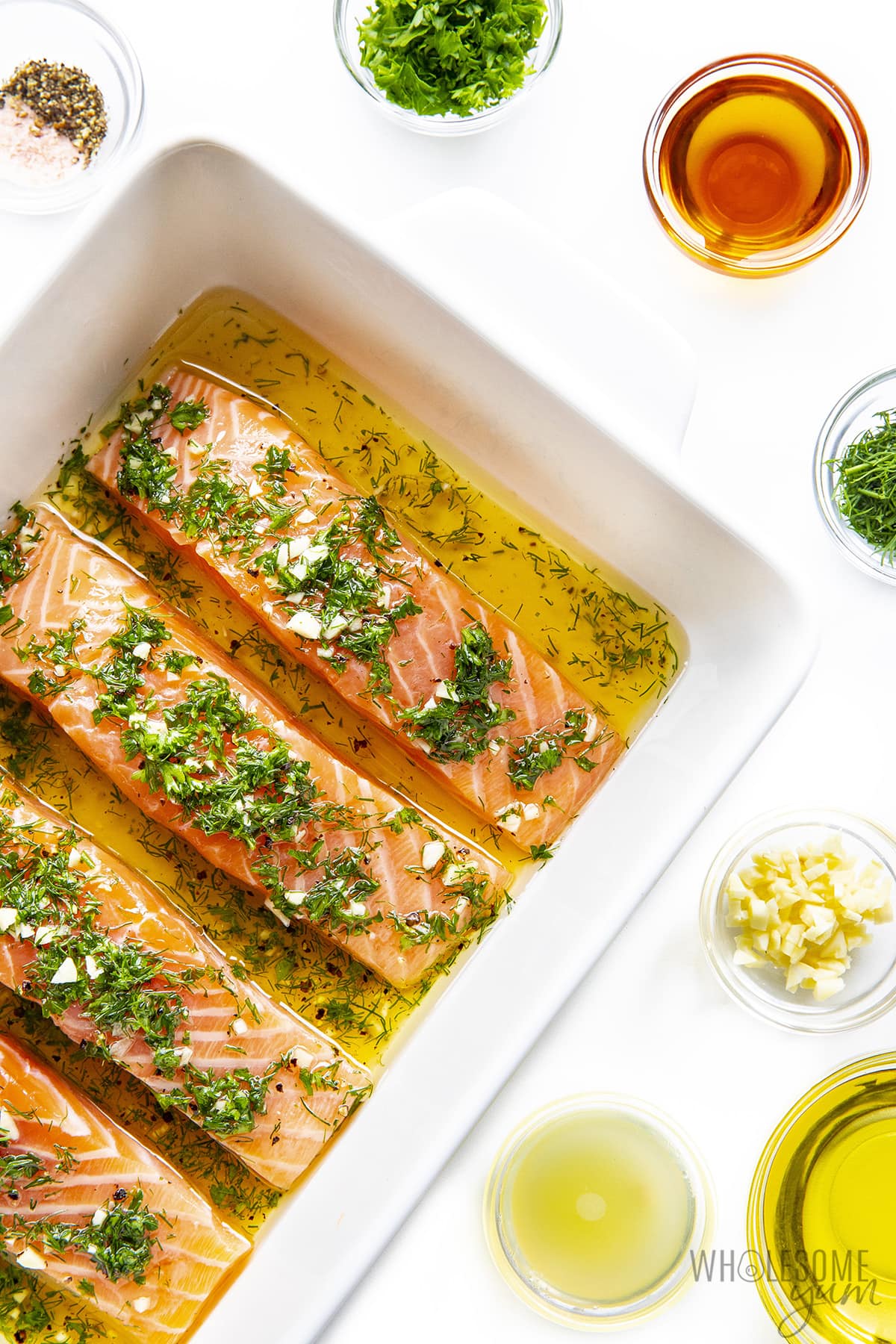 Salmon marinade recipe with fillets in baking dish.