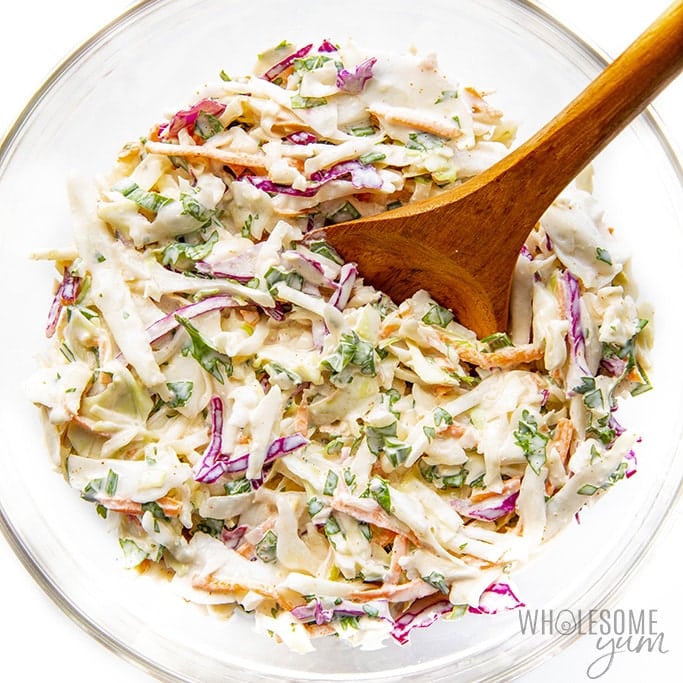 Cabbage slaw for tacos tossed in a bowl
