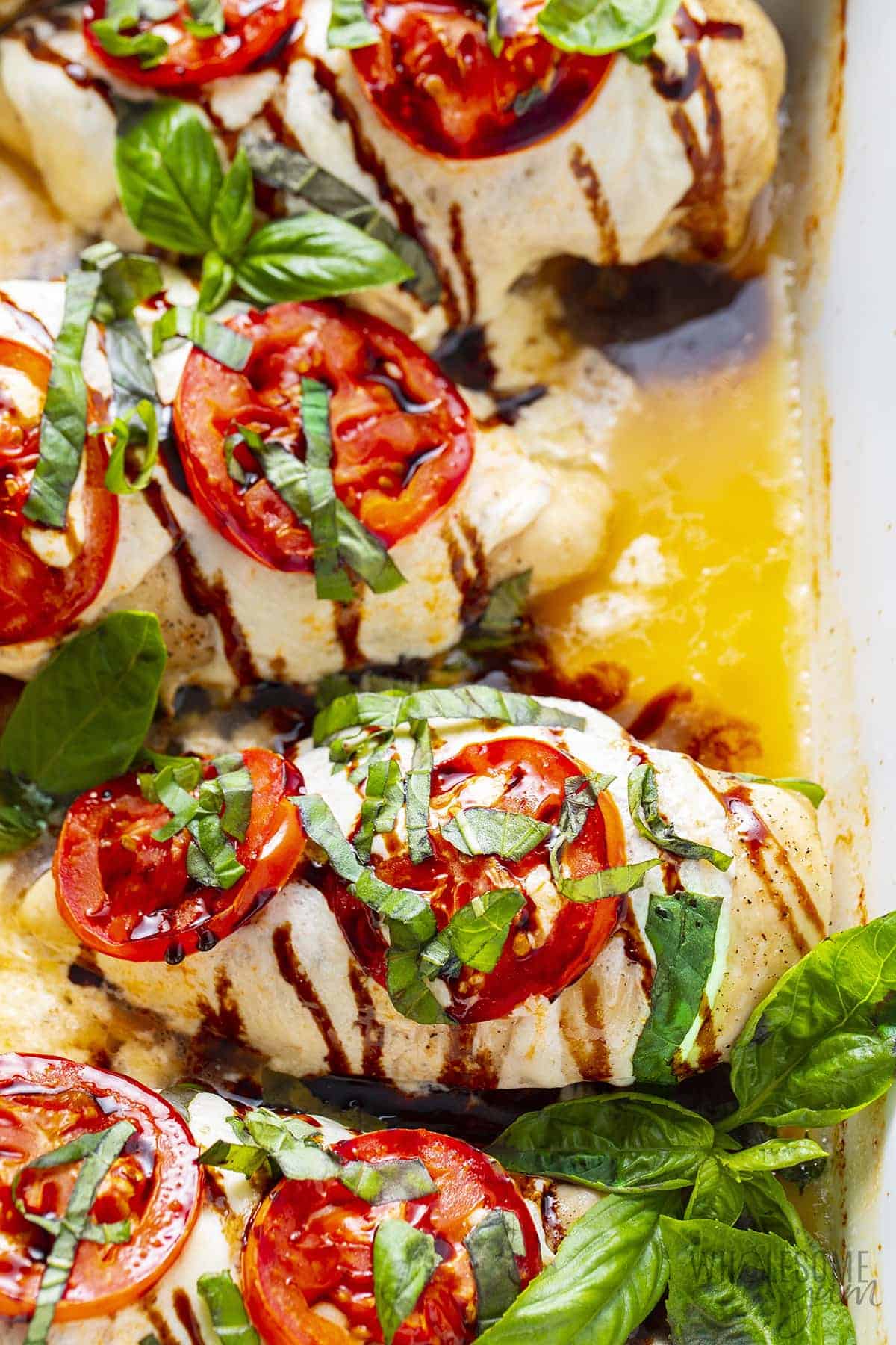 Close up Caprese chicken in a baking dish