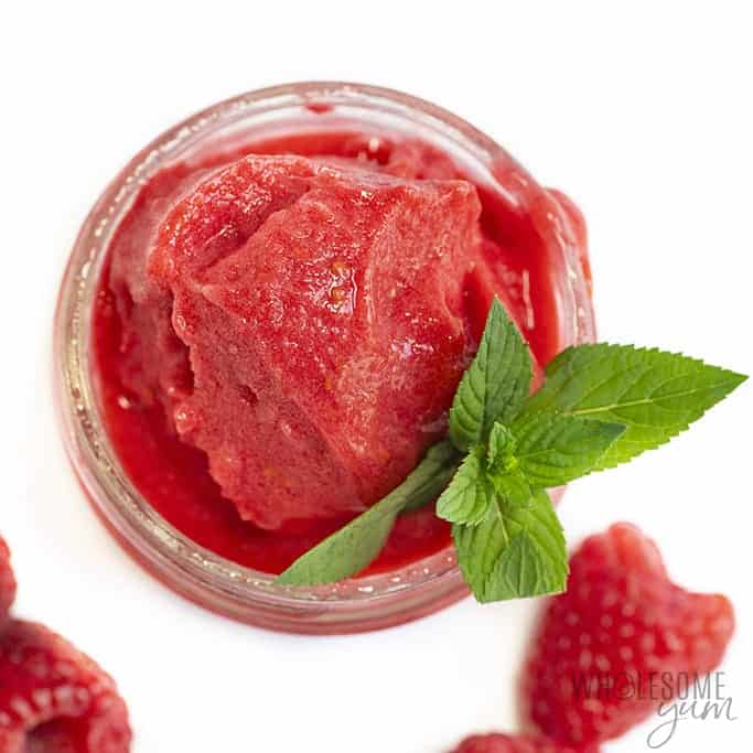 Cup of raspberry sorbet with mint leaf