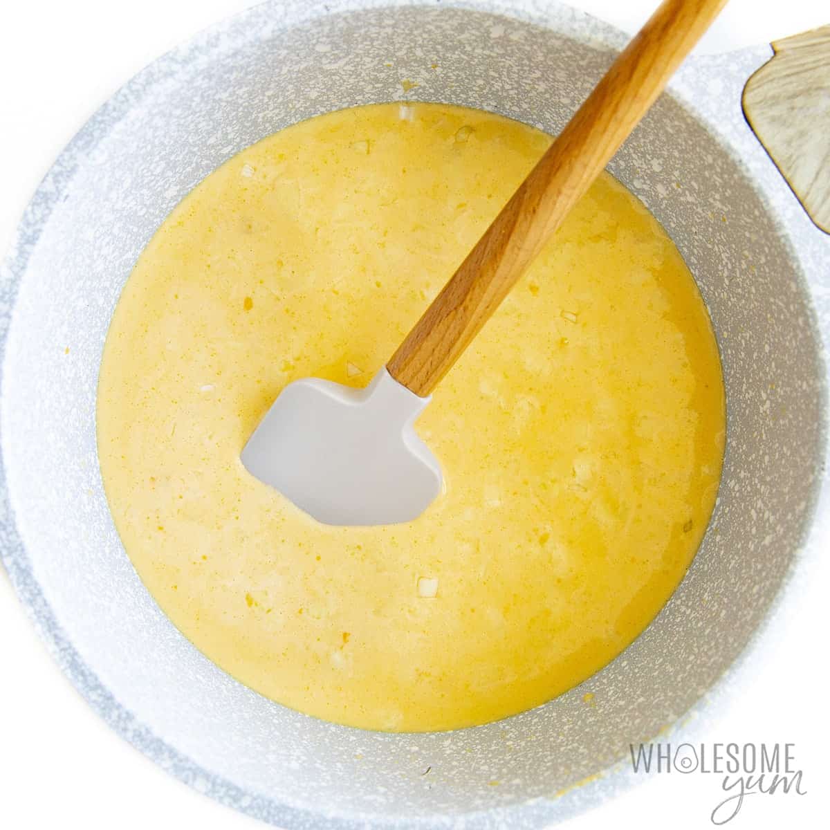 Cheese sauce in a saucepan.