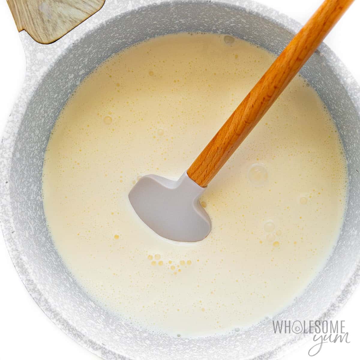 Cream heating in a saucepan