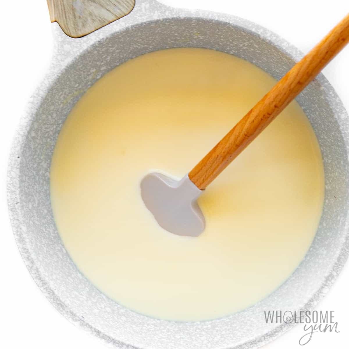 Mascarpone cheese base cooling in a saucepan