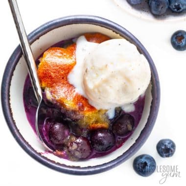 Keto blueberry cobbler recipe in a bowl with ice cream