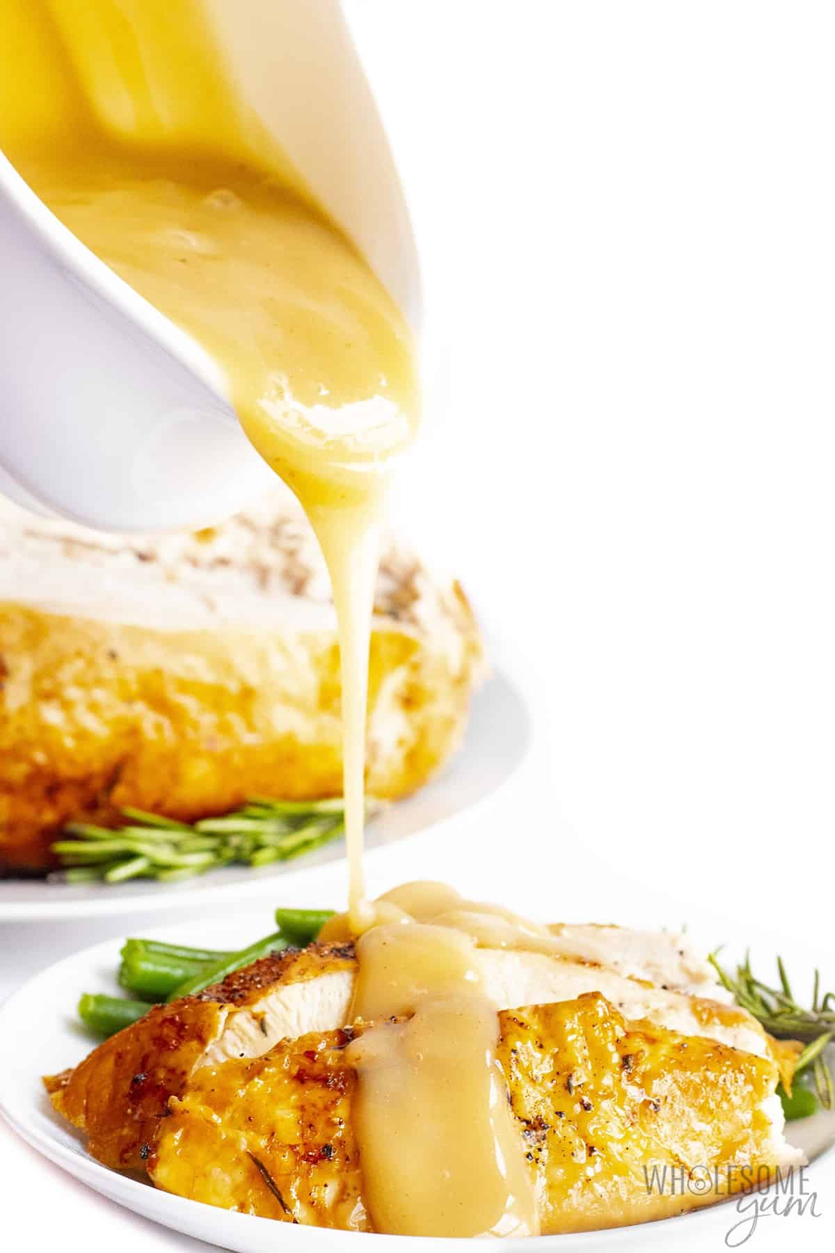 Sliced air fryer turkey breast drizzled with gravy.