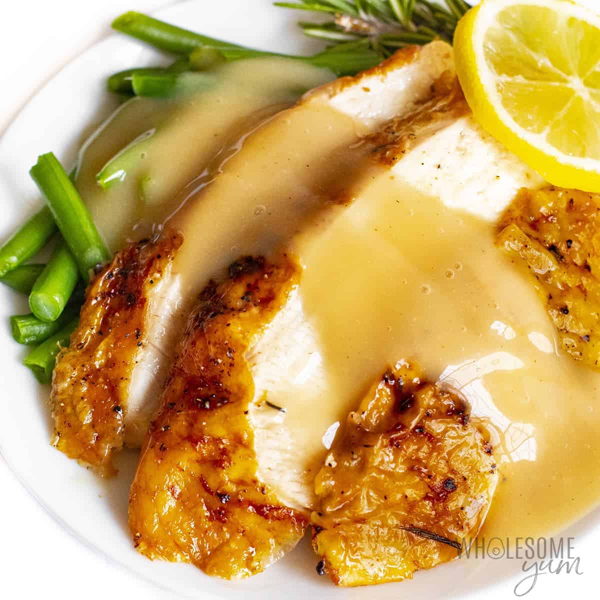 Air fryer turkey breast drizzled with gravy.
