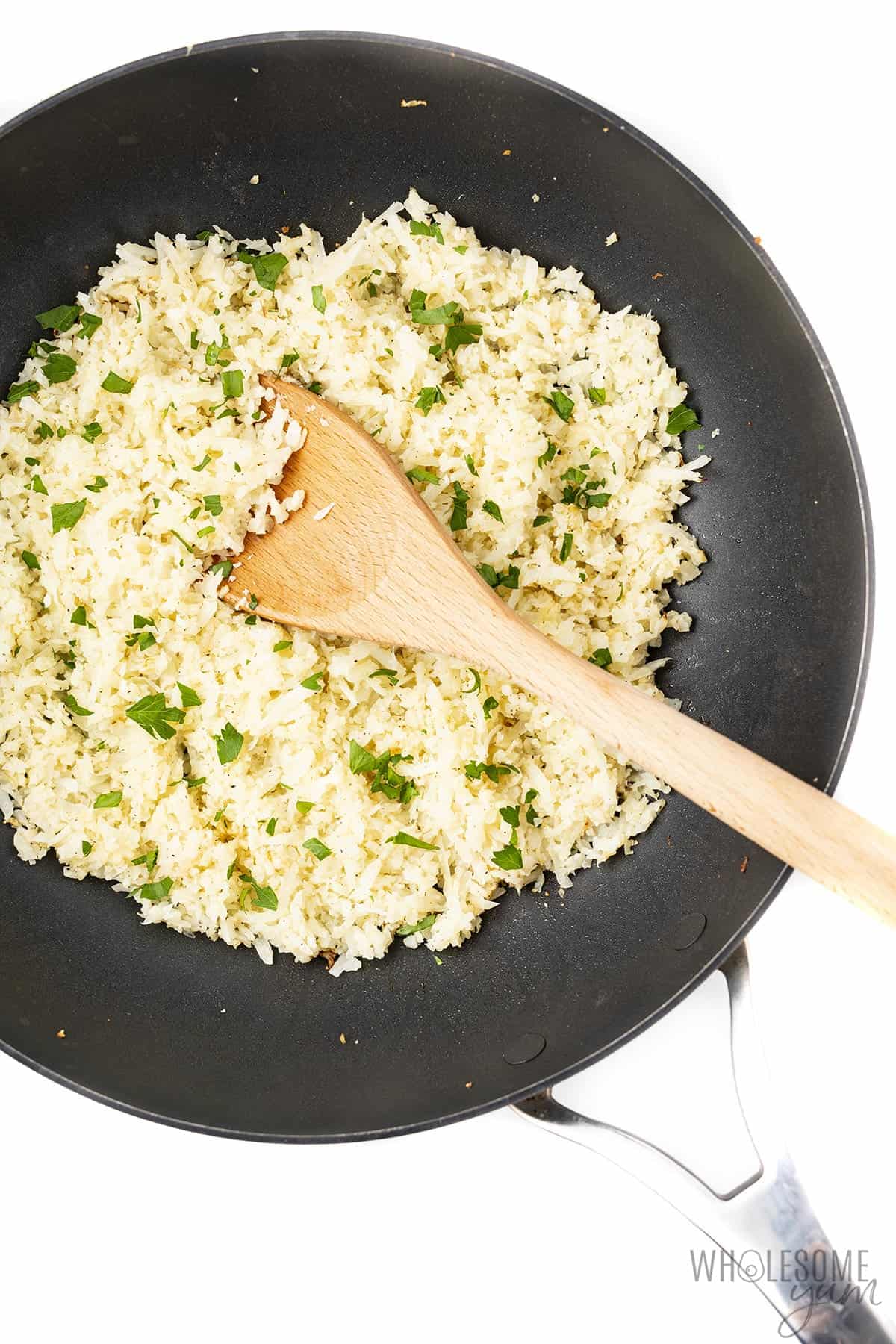 Cooking cauliflower rice in a frying pan