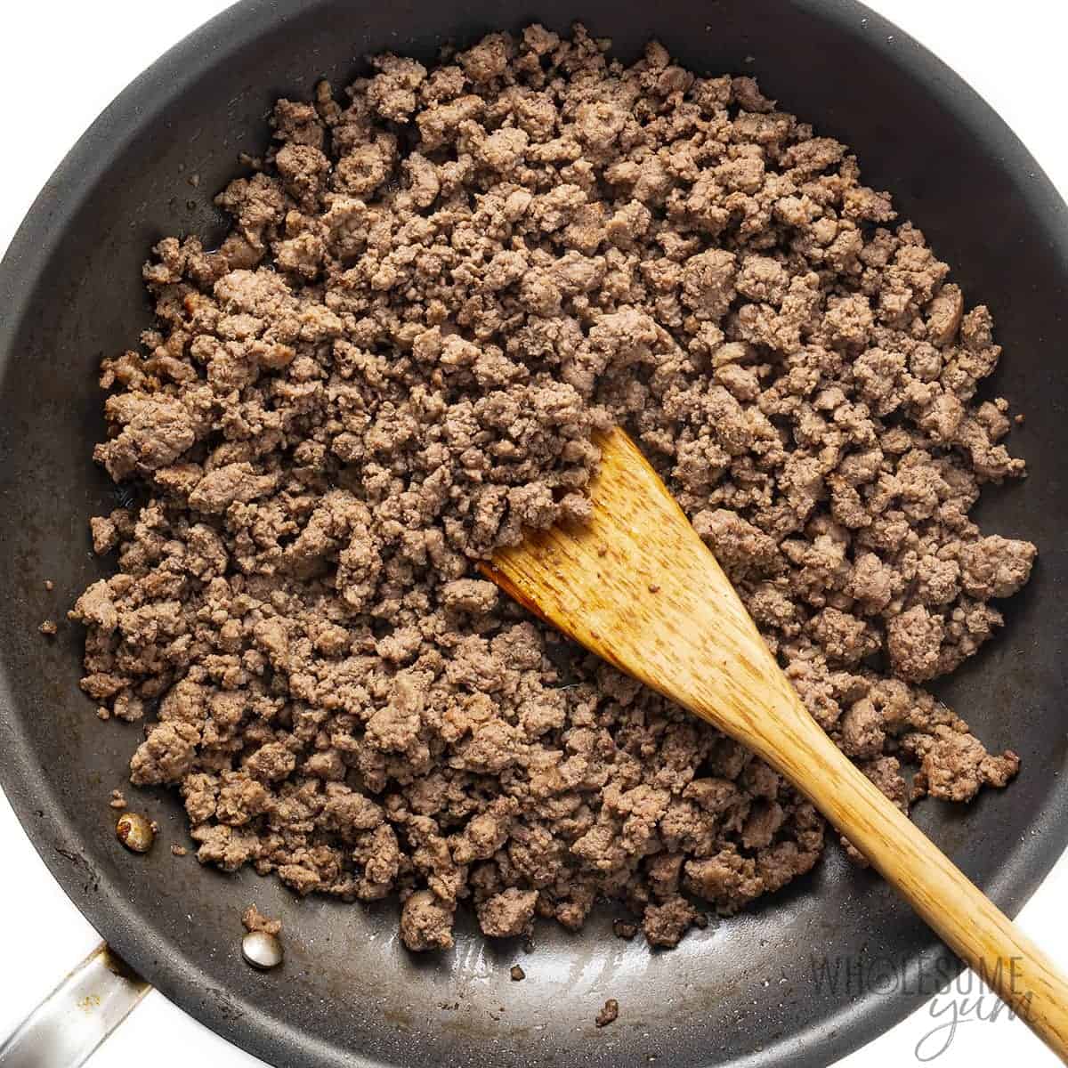 Ground beef browning in a skillet