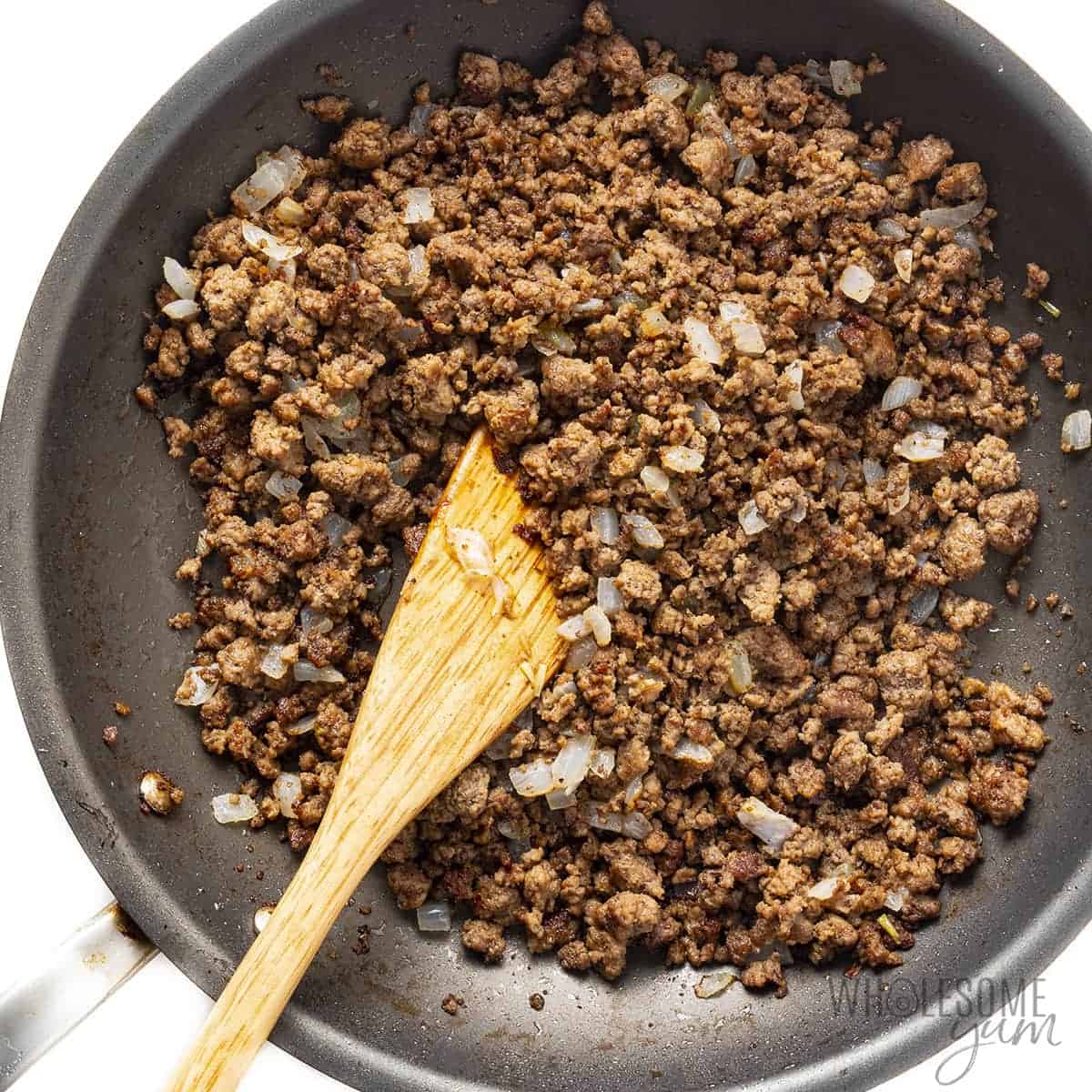 Onions and ground beef in a skillet