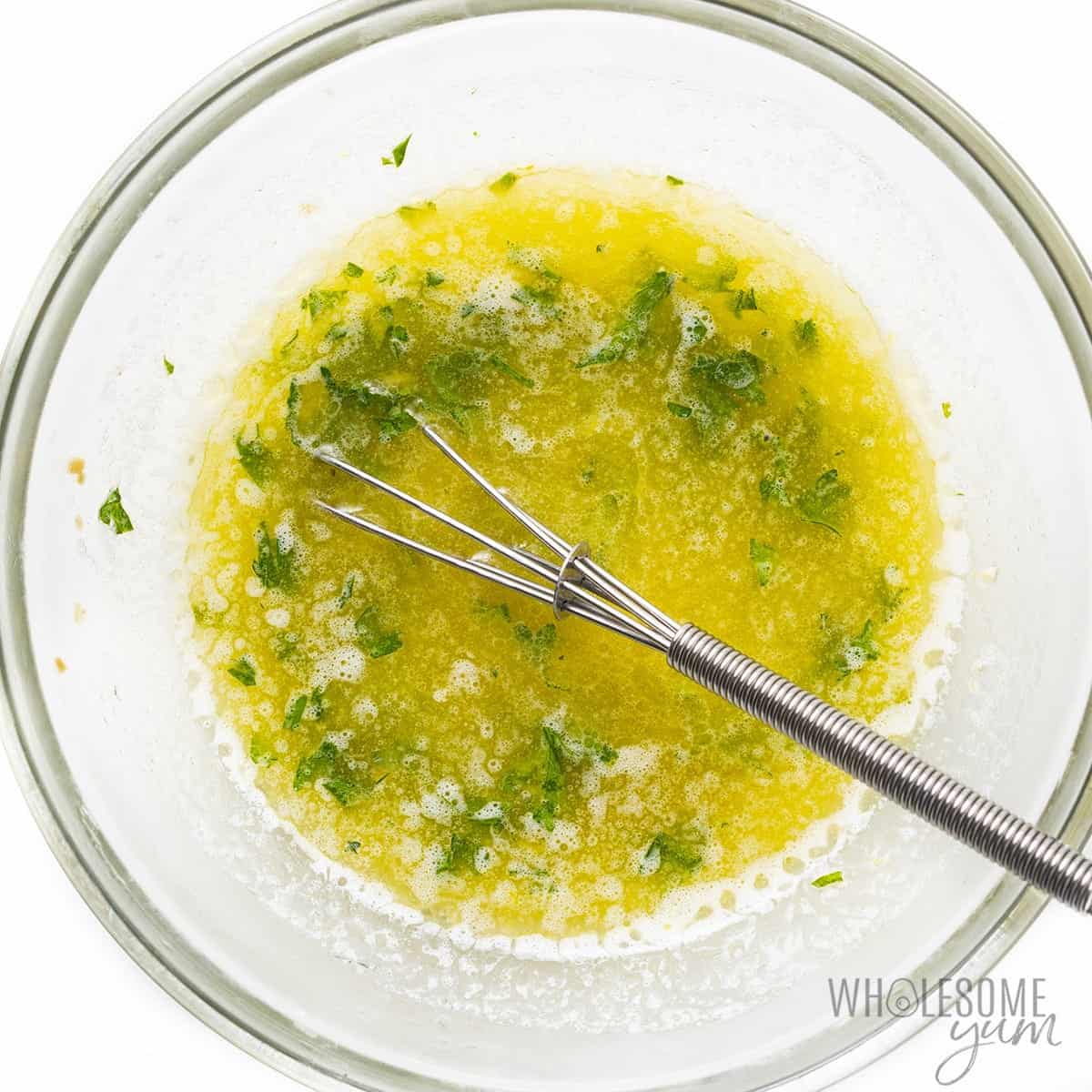 Lemon butter sauce in a glass bowl.