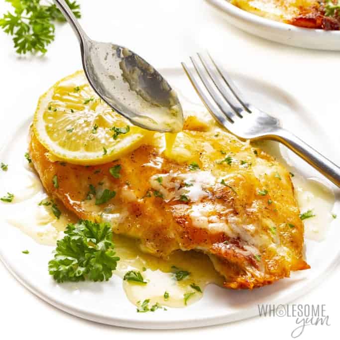 Tilapia fillet with lemon butter sauce drizzled over the top