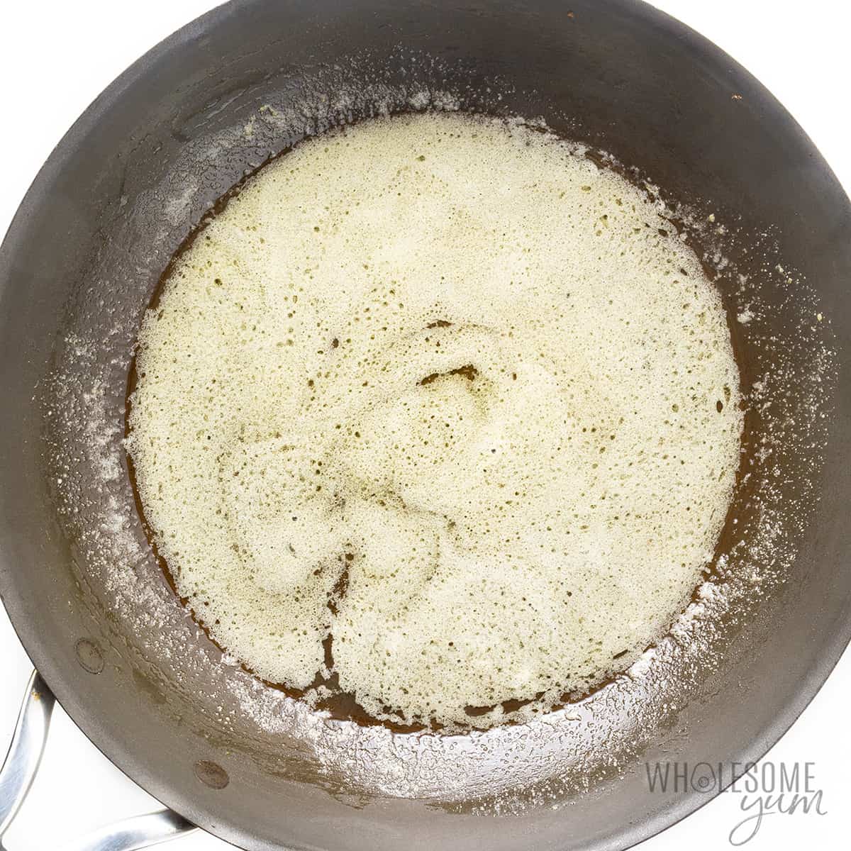 Lemon butter sauce in frying pan.
