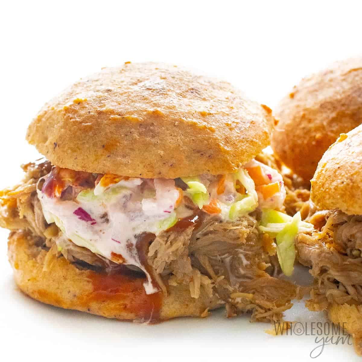 Pulled pork sandwiches on a plate.