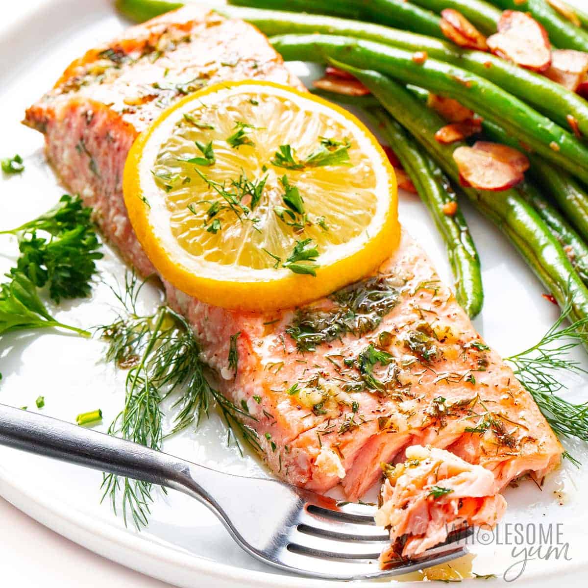 Baked salmon recipe up close on a plate.