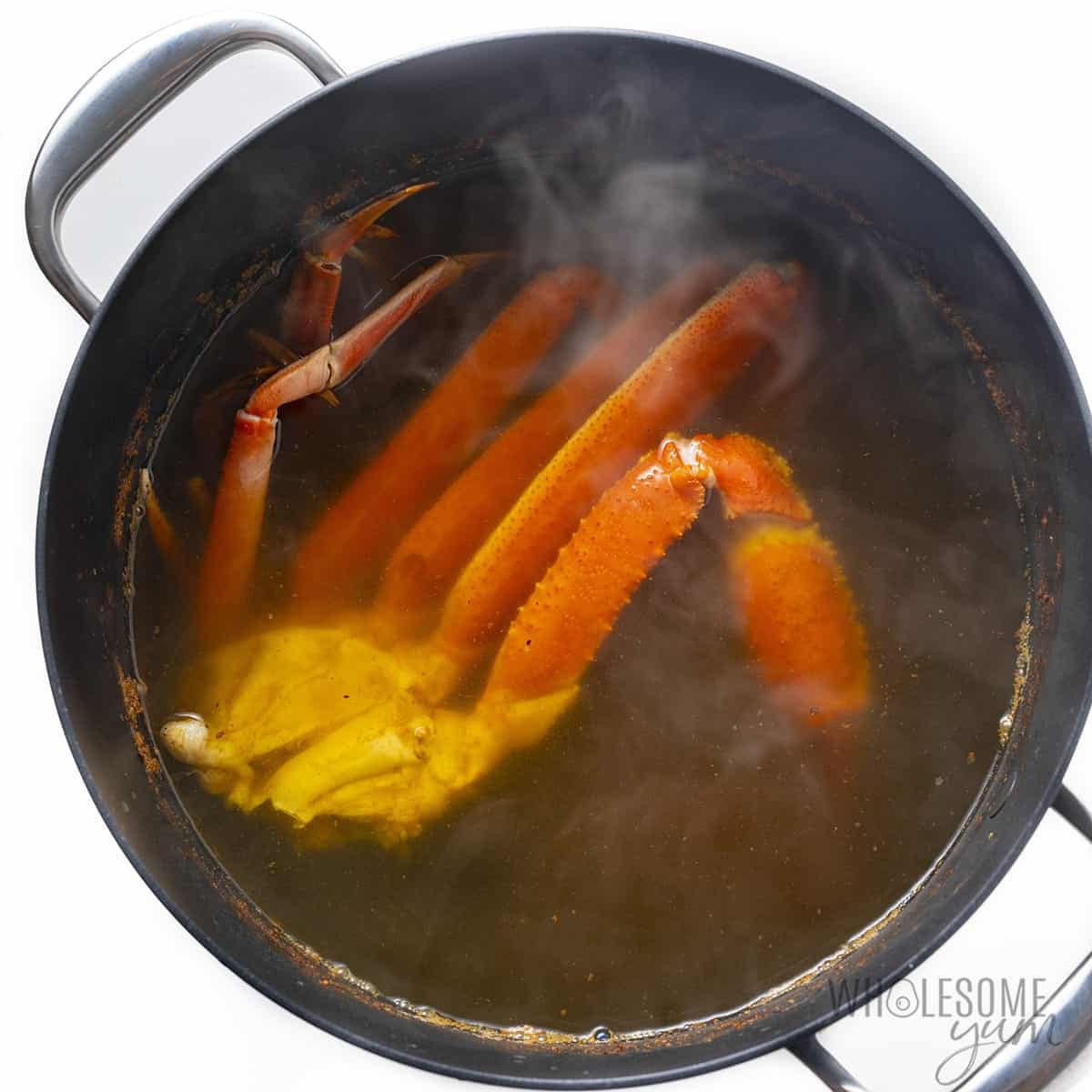 Boiled crab legs in a pot