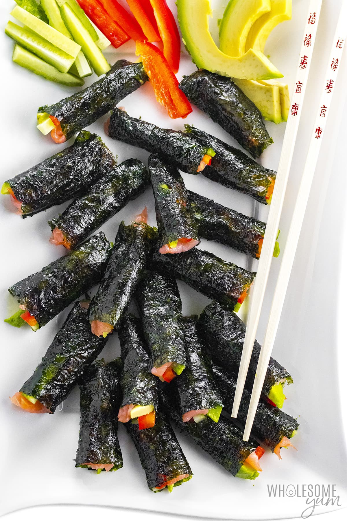 Keto sushi rolls with chopsticks.