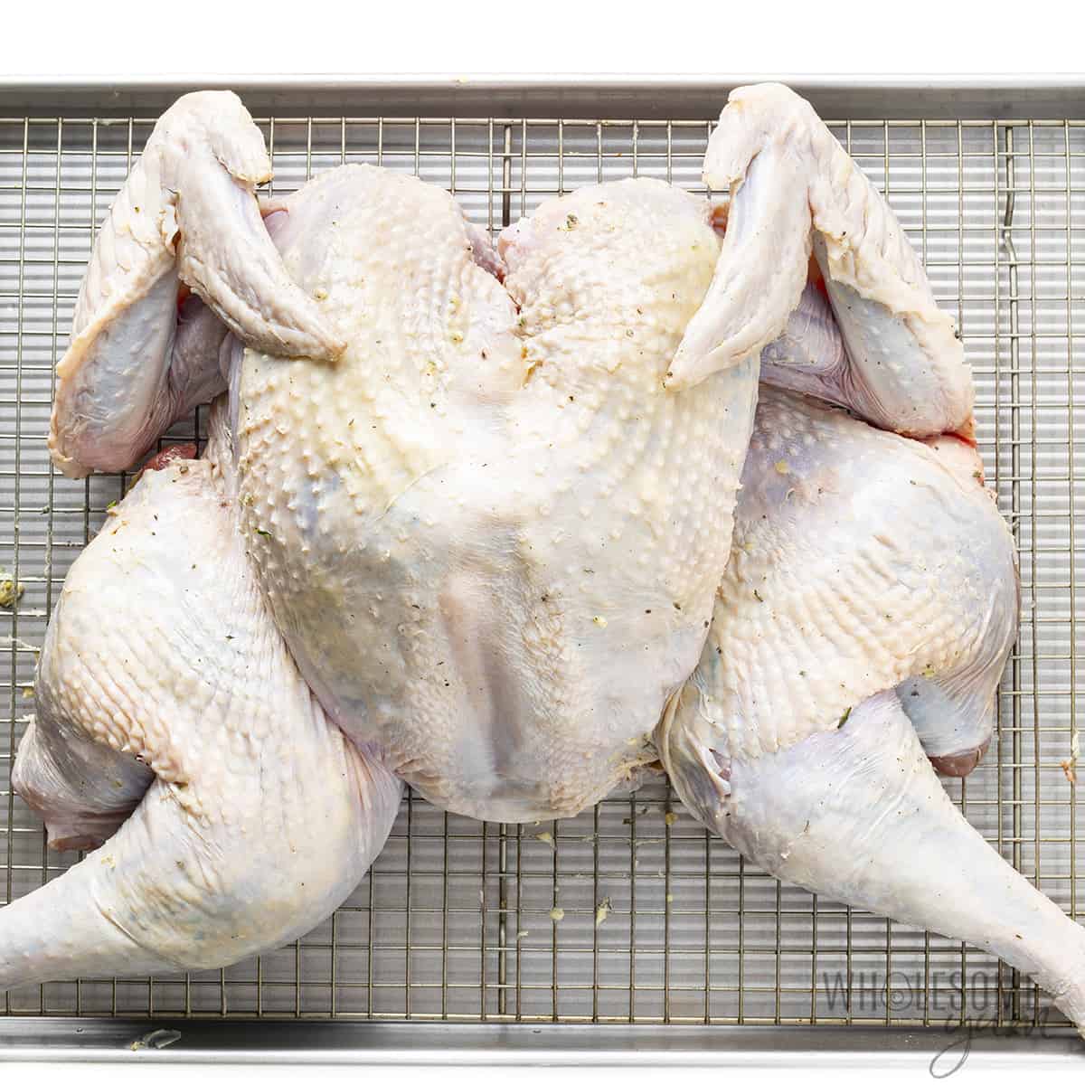 Spatchcocked turkey with garlic butter underneath the skin
