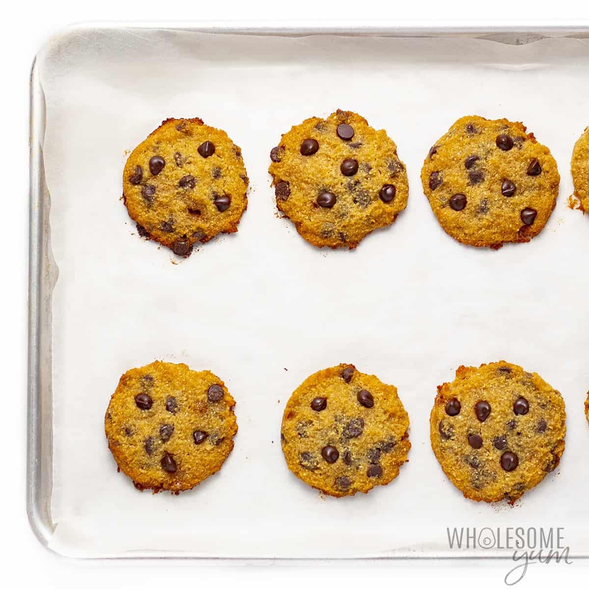 Fully baked coconut chocolate chip cookies on baking pan